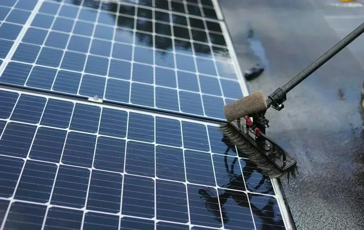 Solar installer securing rooftop panels and mounting hardware